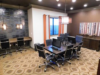 A conference room with a long table and chairs